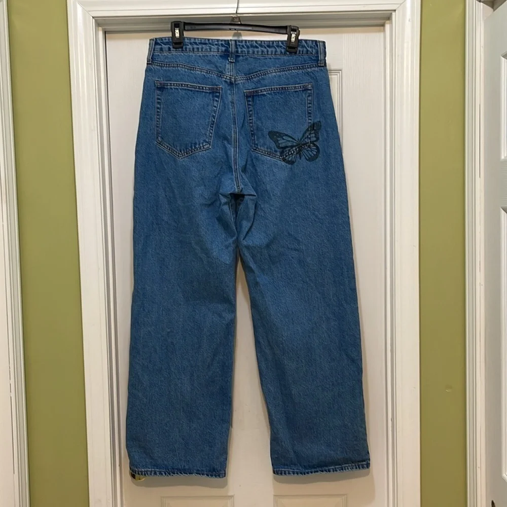 Rue 21 - medium wash blue jeans with black butterfly prints - sizer 16